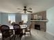 Bright dining room with a fireplace and block windows at 910 Lake Ave, Edgewater, FL 32132