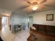 Spacious living room with comfy seating and access to the kitchen at 910 Lake Ave, Edgewater, FL 32132