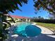 Large kidney-shaped pool with surrounding patio at 910 Lake Ave, Edgewater, FL 32132