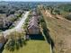 Aerial view of townhouses community, showing a row of homes and green space at 3204 Calabria Ave # 443, Davenport, FL 33897