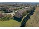 Aerial view of townhouses, showcasing a row of homes and a large green area at 3204 Calabria Ave # 443, Davenport, FL 33897