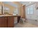 Clean bathroom with tub, shower, and granite vanity at 3204 Calabria Ave # 443, Davenport, FL 33897