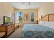 King bedroom with large windows and backyard view at 3204 Calabria Ave # 443, Davenport, FL 33897