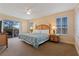 Spacious main bedroom with a king-size bed and private balcony access at 3204 Calabria Ave # 443, Davenport, FL 33897