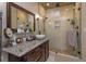 Modern bathroom with a large walk-in shower and granite countertop at 3115 Albert St, Orlando, FL 32806