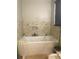 Bathroom with soaking tub and tile surround at 3115 Albert St, Orlando, FL 32806