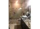 Clean bathroom with granite vanity and a large walk-in shower at 3115 Albert St, Orlando, FL 32806