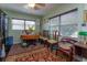 Cozy dining area with a wood table, chairs, and rich patterned rug at 3115 Albert St, Orlando, FL 32806