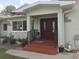 Double wood doors with tiled entryway and landscaping at 3115 Albert St, Orlando, FL 32806