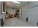 Clean and organized garage with tile flooring and extra storage at 3115 Albert St, Orlando, FL 32806