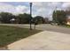 Residential street view with lake view in background at 3115 Albert St, Orlando, FL 32806