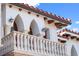 Close-up of a balcony with decorative railings and an arched design at 4852 S Peninsula Dr, Ponce Inlet, FL 32127