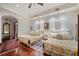 Comfortable bedroom with hardwood floors and two beds at 4852 S Peninsula Dr, Ponce Inlet, FL 32127