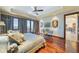 Main bedroom with hardwood floors and balcony access and comfortable seating at 4852 S Peninsula Dr, Ponce Inlet, FL 32127
