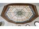 Elaborate stained glass ceiling with a geometric pattern and colorful details at 4852 S Peninsula Dr, Ponce Inlet, FL 32127