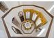 High angle view of an elegant dining room with yellow chairs and decorative table at 4852 S Peninsula Dr, Ponce Inlet, FL 32127