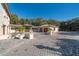 Spacious driveway leading to the garage and guest house, adorned with beautiful landscaping at 4852 S Peninsula Dr, Ponce Inlet, FL 32127