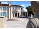 Elegant home exterior with a central water feature and manicured landscaping at 4852 S Peninsula Dr, Ponce Inlet, FL 32127