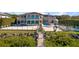 A view of the backyard of the house featuring an extra long pool and a small outdoor gazebo at 4852 S Peninsula Dr, Ponce Inlet, FL 32127