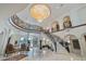Expansive foyer with a grand staircase, chandelier, and painted dome at 4852 S Peninsula Dr, Ponce Inlet, FL 32127