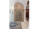 Unique front door entrance boasting stone pillars and large iron accents at 4852 S Peninsula Dr, Ponce Inlet, FL 32127