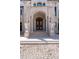 Grand front entrance with a large wooden door and decorative lion statues at 4852 S Peninsula Dr, Ponce Inlet, FL 32127