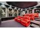 Entertain in this home theater with tiered seating, movie posters, and starry night ceiling at 4852 S Peninsula Dr, Ponce Inlet, FL 32127