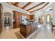 Spacious kitchen with stainless appliances, custom wood cabinets, and large central island at 4852 S Peninsula Dr, Ponce Inlet, FL 32127