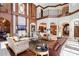 Spacious living room boasts high ceilings, detailed woodwork, and large windows at 4852 S Peninsula Dr, Ponce Inlet, FL 32127