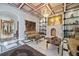Elegant living room with fireplace, marble floors, decorative ceilings, and sophisticated furnishings at 4852 S Peninsula Dr, Ponce Inlet, FL 32127