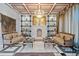 Elegant living room boasting marble floors, fireplace, decorative ceilings, and sophisticated furnishings at 4852 S Peninsula Dr, Ponce Inlet, FL 32127