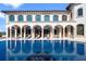 Relax in your private pool with an arched colonnade and covered seating area at 4852 S Peninsula Dr, Ponce Inlet, FL 32127