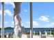 Elegant statue overlooking the beautiful waterfront view on a sunny day at 4852 S Peninsula Dr, Ponce Inlet, FL 32127