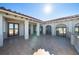 Large terrace with tile flooring, covered area, and exterior access at 4852 S Peninsula Dr, Ponce Inlet, FL 32127