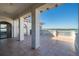 Covered outdoor terrace with columns and railings overlooking the intracoastal waterway at 4852 S Peninsula Dr, Ponce Inlet, FL 32127