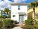 The home features a patio with a hot tub, dining table, and manicured landscaping at 3001 Sea Plane Ln, Kissimmee, FL 34747