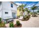 The home features a patio with a hot tub, dining table, lounge chair, and landscaping at 3001 Sea Plane Ln, Kissimmee, FL 34747
