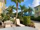 The homes feature patios with hot tubs, dining tables, lounge chairs, and lush landscaping at 3001 Sea Plane Ln, Kissimmee, FL 34747