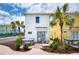 The home features a patio with a hot tub, dining table, and landscaping at 3001 Sea Plane Ln, Kissimmee, FL 34747