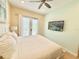 Inviting bedroom with a comfortable bed and a flat-screen television at 3001 Sea Plane Ln, Kissimmee, FL 34747