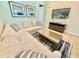 Bright living room featuring a comfortable sectional sofa, stylish rug, and neutral decor at 3001 Sea Plane Ln, Kissimmee, FL 34747
