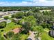 Aerial view of home with large, grassy yard and mature trees at 966 N Ronald Reagan Blvd, Longwood, FL 32750