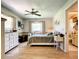 Inviting bedroom with laminate flooring, neutral walls, and windows for natural light at 966 N Ronald Reagan Blvd, Longwood, FL 32750