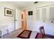 Cozy bedroom featuring carpeting, neutral walls, and a closet with louvered doors at 966 N Ronald Reagan Blvd, Longwood, FL 32750