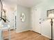 Inviting entryway with light wood floors, and natural light from the front door, offering a warm welcome into the home at 966 N Ronald Reagan Blvd, Longwood, FL 32750