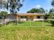 Charming home with well-maintained lawn, mature trees, and white picket fence at 966 N Ronald Reagan Blvd, Longwood, FL 32750