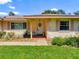 Close-up of a well-maintained single-story home with a manicured front yard at 966 N Ronald Reagan Blvd, Longwood, FL 32750
