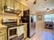 Bright kitchen featuring stainless steel appliances, and great natural light, perfect for everyday cooking and Gathering meals at 966 N Ronald Reagan Blvd, Longwood, FL 32750