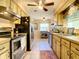 Functional kitchen with stainless steel appliances, ample counter space, and natural light creating an inviting cooking environment at 966 N Ronald Reagan Blvd, Longwood, FL 32750