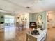 Cozy living area with natural light, inviting seating and seamless access to the sunroom that enhances everyday living at 966 N Ronald Reagan Blvd, Longwood, FL 32750